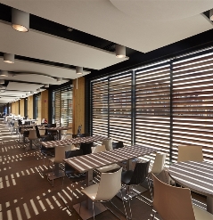 aluminum shutter panels with fixed louvres at an angle showing from the inside out for sun protectio