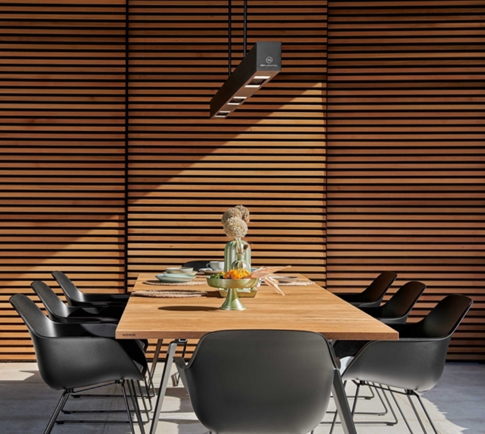 Heatsail BEEM light and heater above outdoor dining table. 