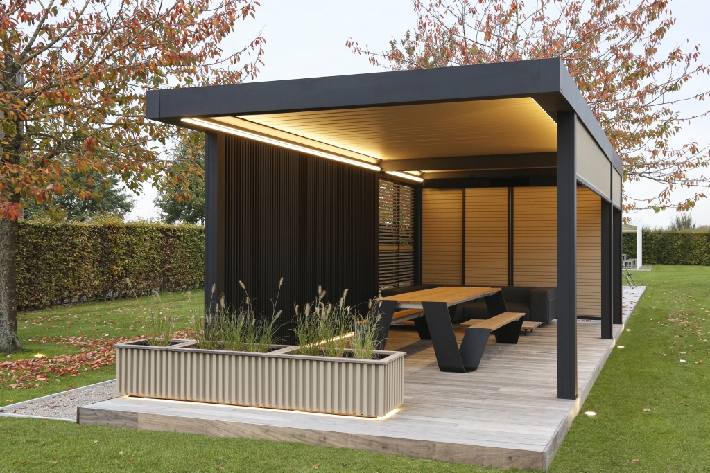Linarte aluminum wall cladding as enclosure on one side of a louvered pergola over a patio space