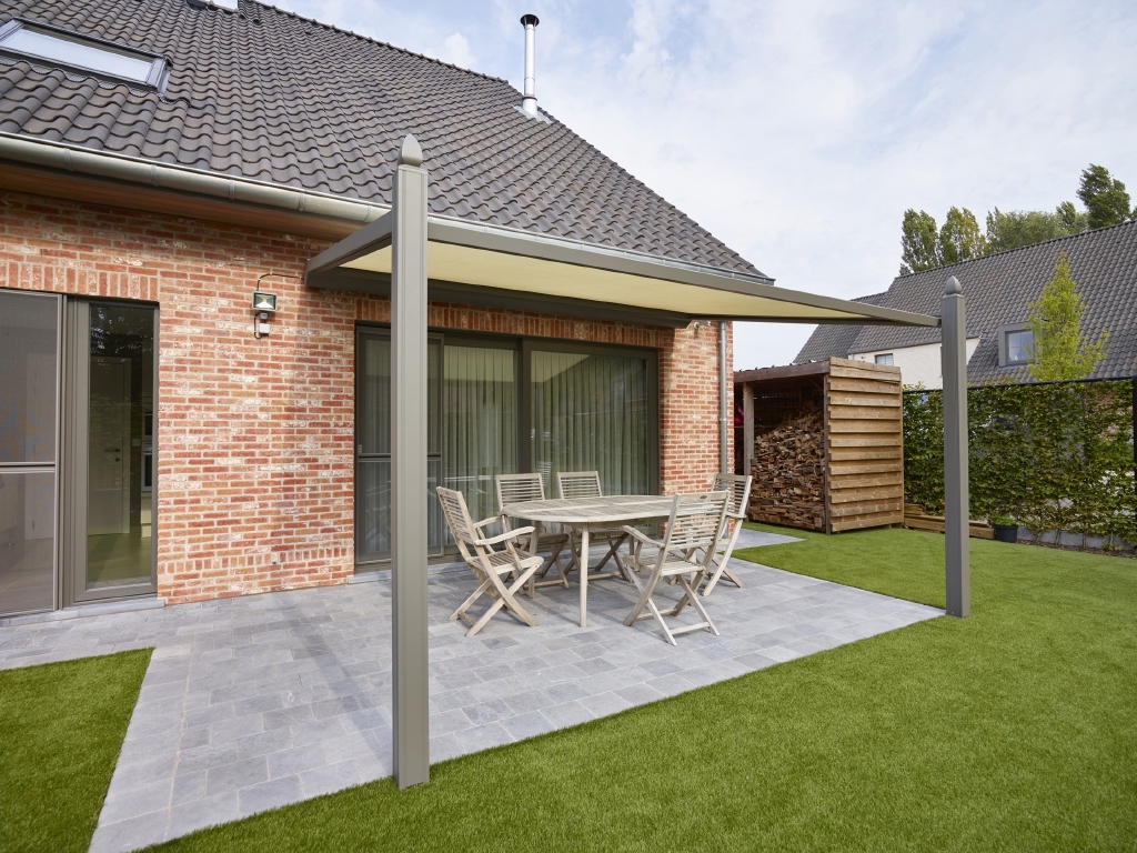 Pergola with a retractable awning attached to home Pergola with a retractable awning attached to home