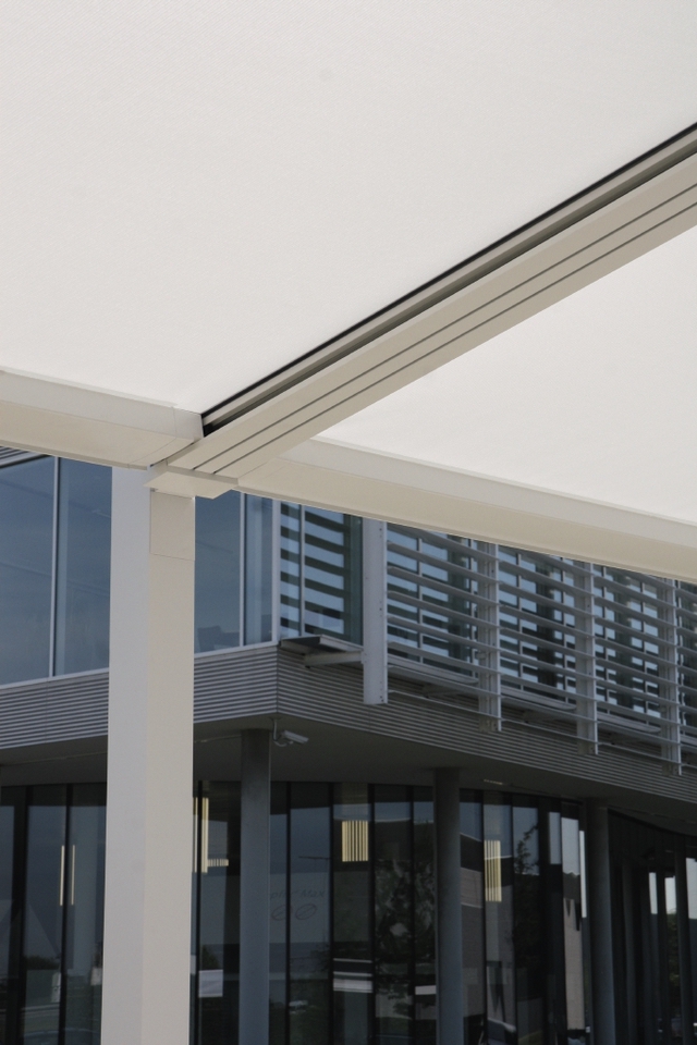 Underside close up of cream PVC pergola fabric and columns Underside close up of cream PVC pergola fabric and columns