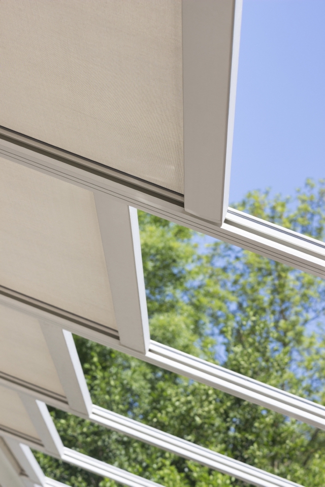 Close under view of PVC pergola retracting Close under view of PVC pergola retracting