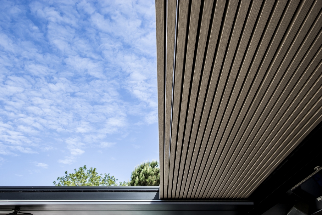 a close up of the louvres in a pergola system stacked together on the right side of the system 