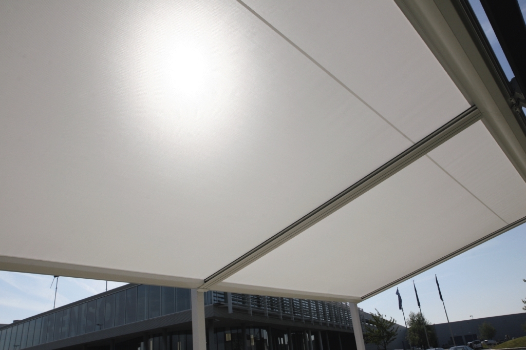 Underside view of cream PVC retractable pergola Underside view of cream PVC retractable pergola