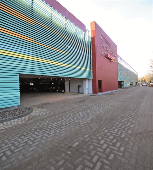 horizontal aluminum cladding in different colours and patterns covering the facade of a building