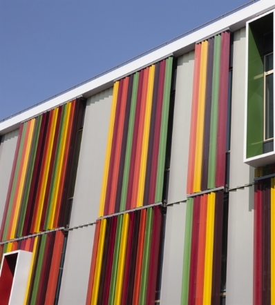 Multi coloured vertical aluminum louvres attached to the outside of building's windows
