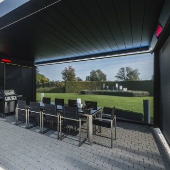 Lite integrated roof in a black aluminum retractable pergola over dining patio