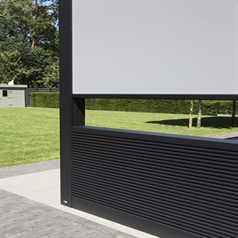 Linius black metal cladding forms a semi wall around patio area