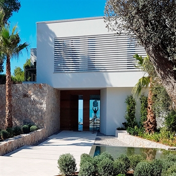 Horizontal white louvres in front of a large front of home window