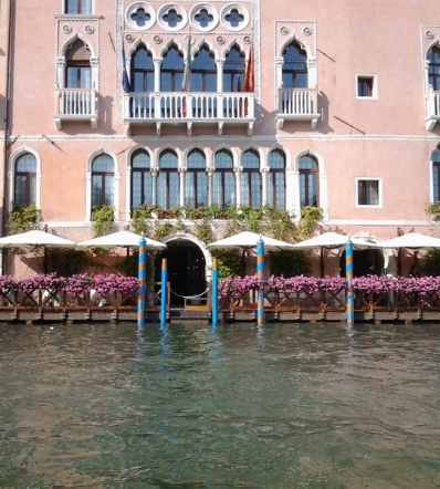 White parasols on a waterfront outdoor restaurant patio