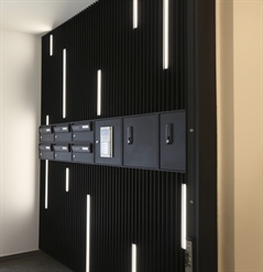 aluminum cladding in black designed for an apartment complex mailbox area