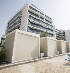 White pergola cabanas totally enlcosed on all sides with white fixscreens