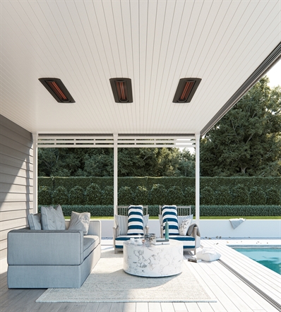 patio alcove of a home with black heaters integrated in the ceiling and furniture underneath