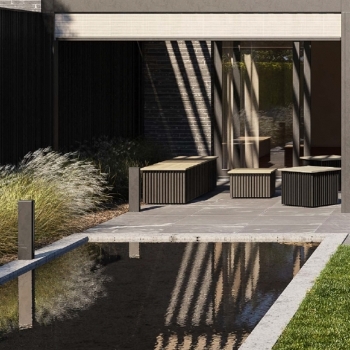 black aluminum garden seated and planters spread out poolside with lighting features nearby