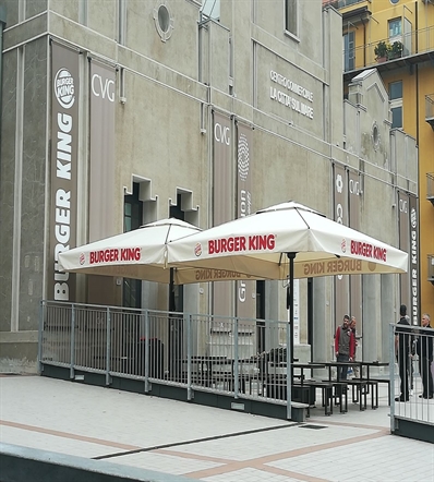 white patio umbrellas branded with Burger King logo for their outdoor patio