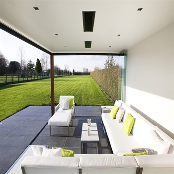 enclosed outdoor patio area with sleek black electric heaters integrated in the ceiling