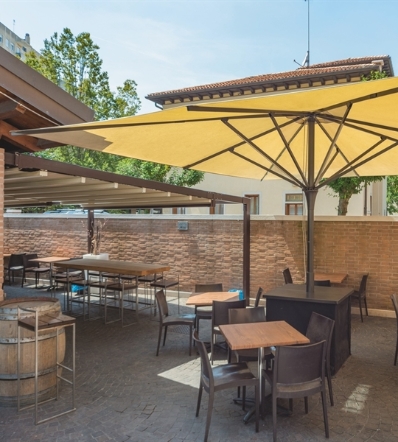 Cream parasol open and shading a restaurant patio