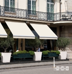 Cream awnings opened over a restaurant patio