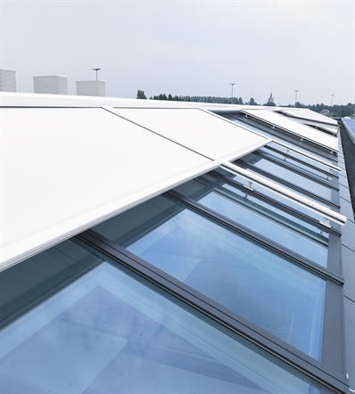 white external roller blinds on the exterior skylight windows of a commercial building