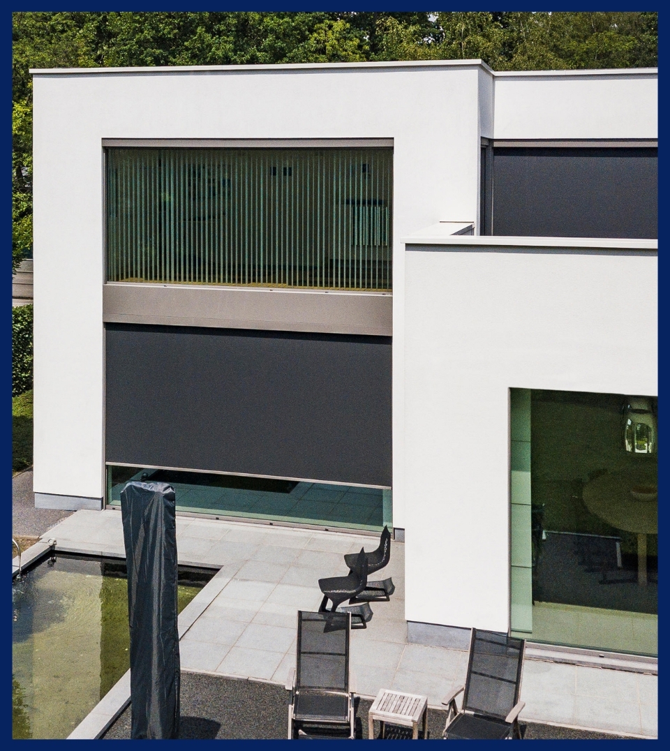 external motorized black sun protection screen surface mounted on the front of a window of a home external motorized black sun protection screen surface mounted on the front of a window of a home