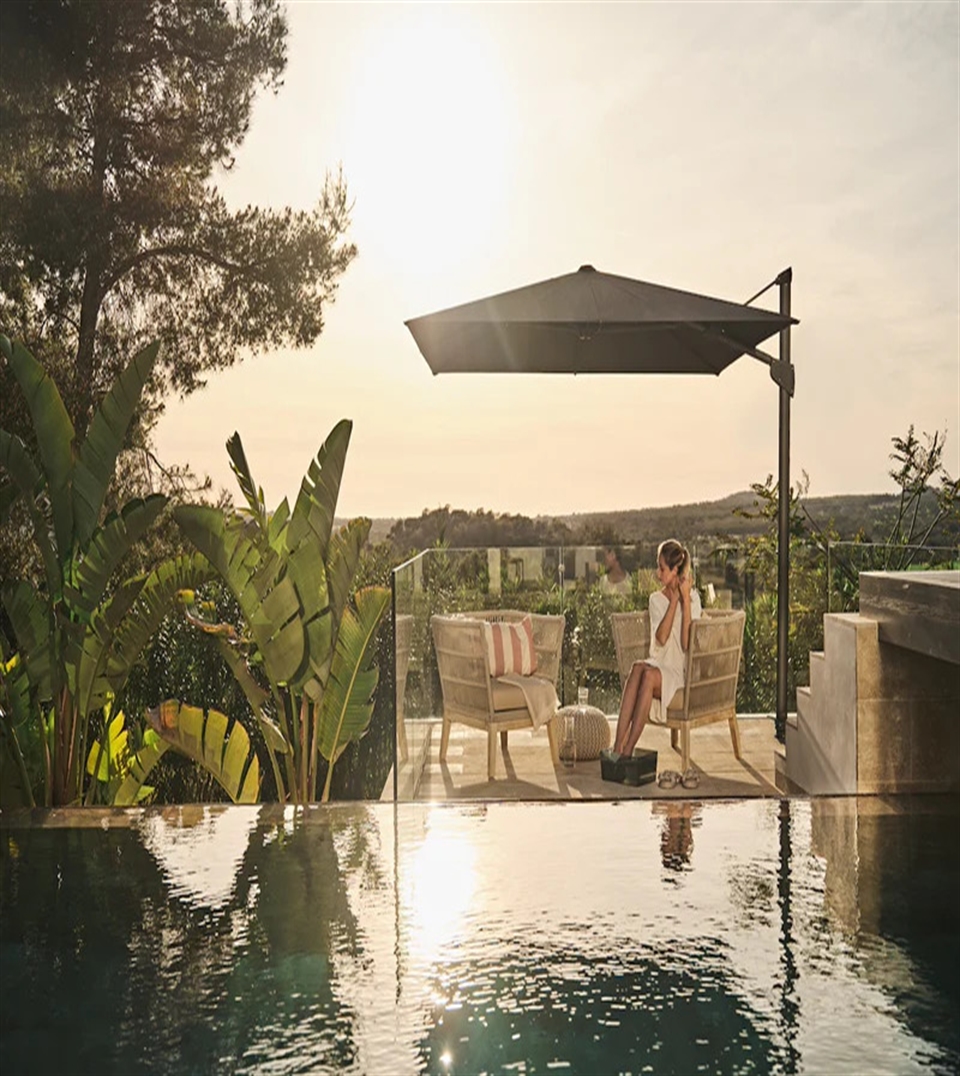 Glatz Fortano cantilever umbrella providing stable shade on a windy waterfront deck.