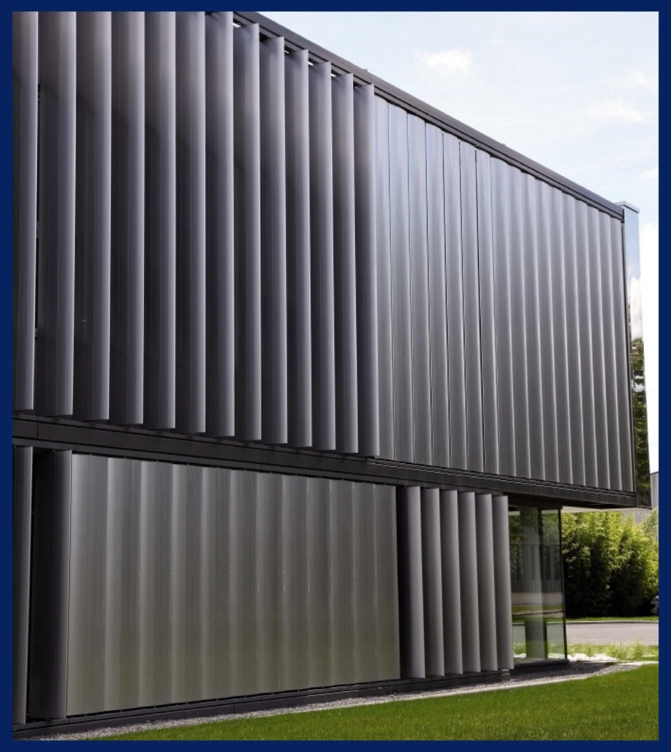grey aluminum vertical brise soleil attached to the facade of a building above window grey aluminum vertical brise soleil attached to the facade of a building above window