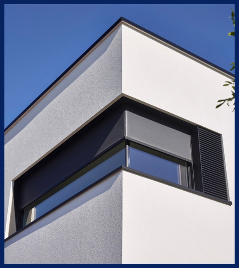 black integrated external roller blind installed on a corner window of a home