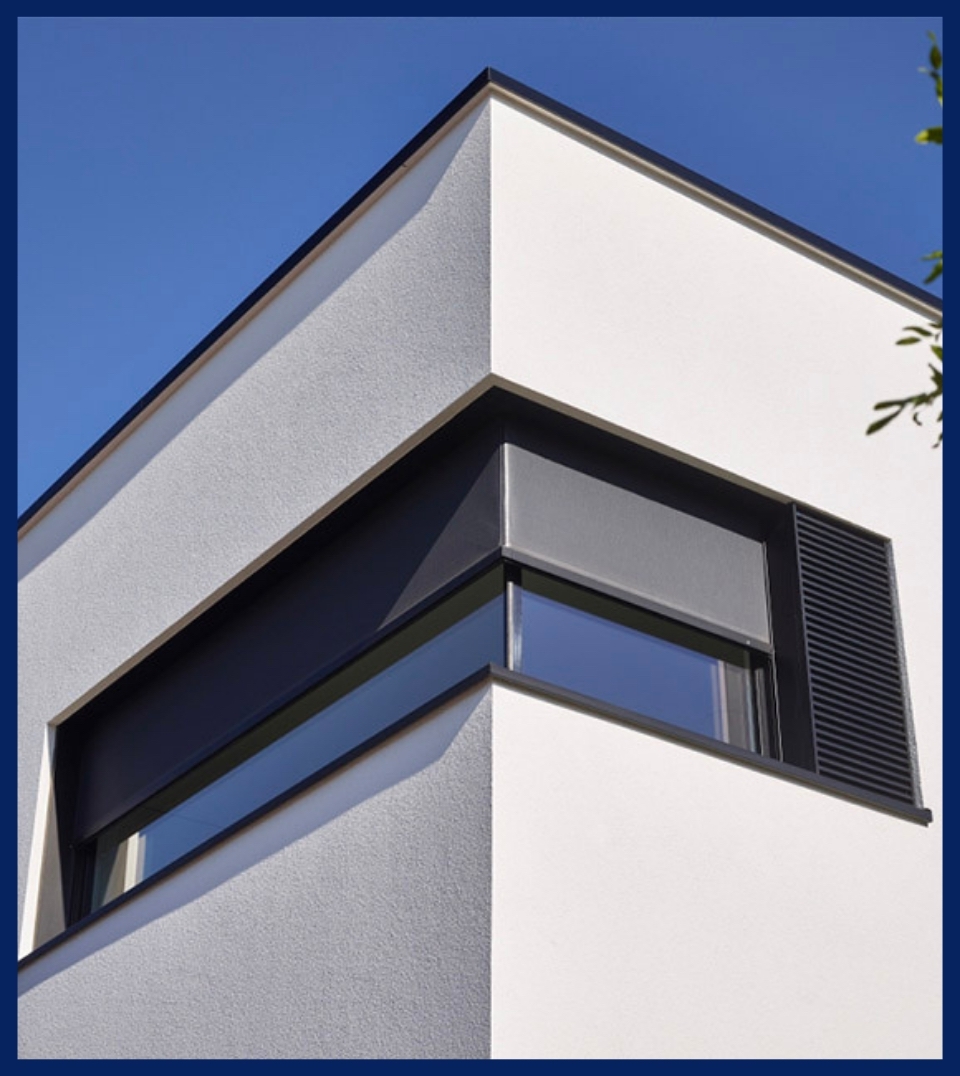 black integrated external roller blind installed on a corner window of a home black integrated external roller blind installed on a corner window of a home