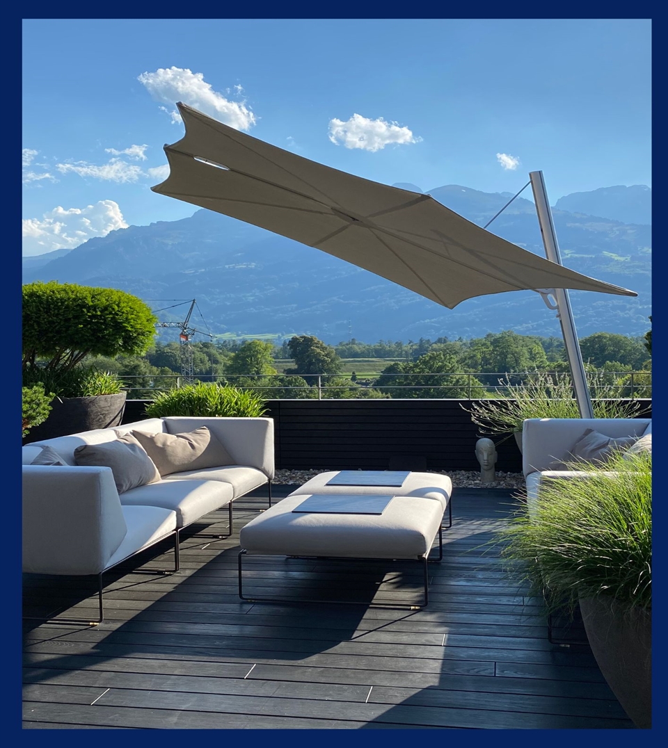 White Umbrosa Spectra umbrella covering a residential patio overlooking the mountains