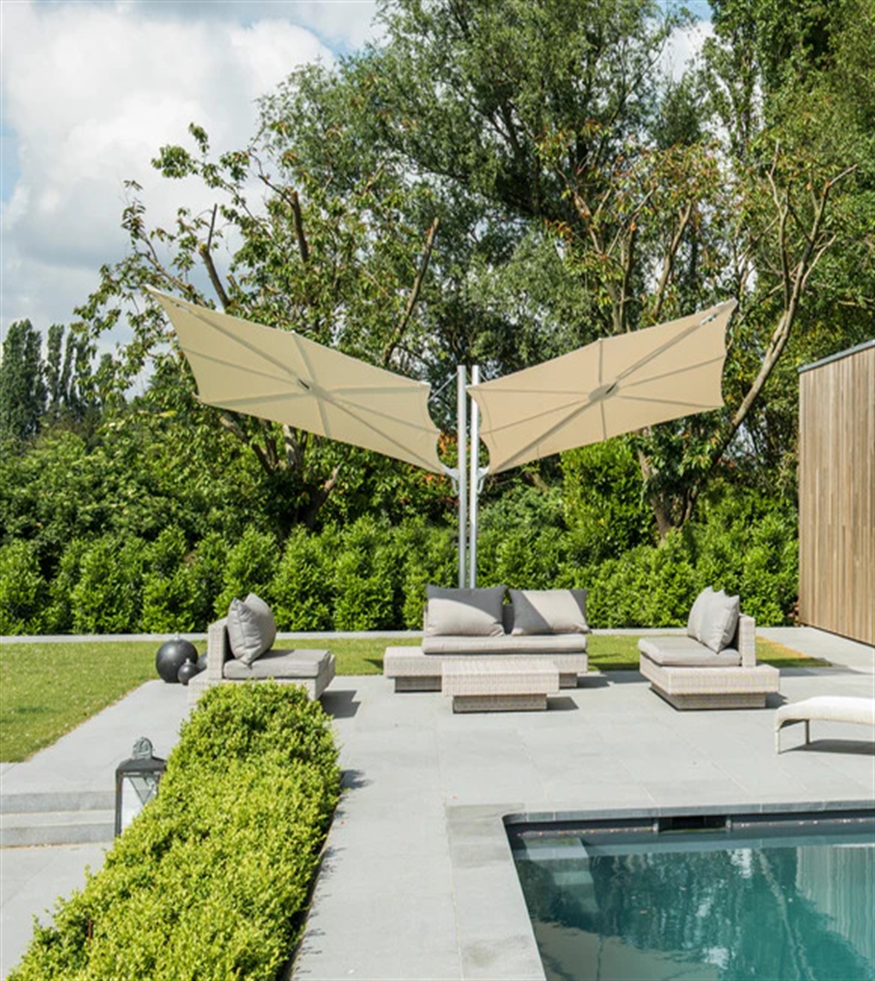 Modern Umbrosa Spectra umbrella with its unique flat-fan canopy tilted toward the sun.