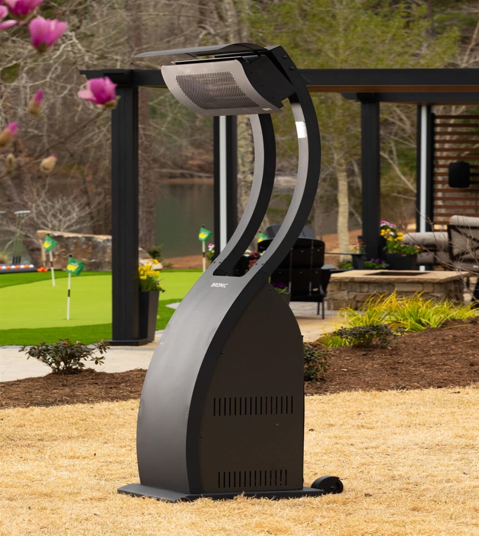 Freestanding patio heater in a landscaped backyard