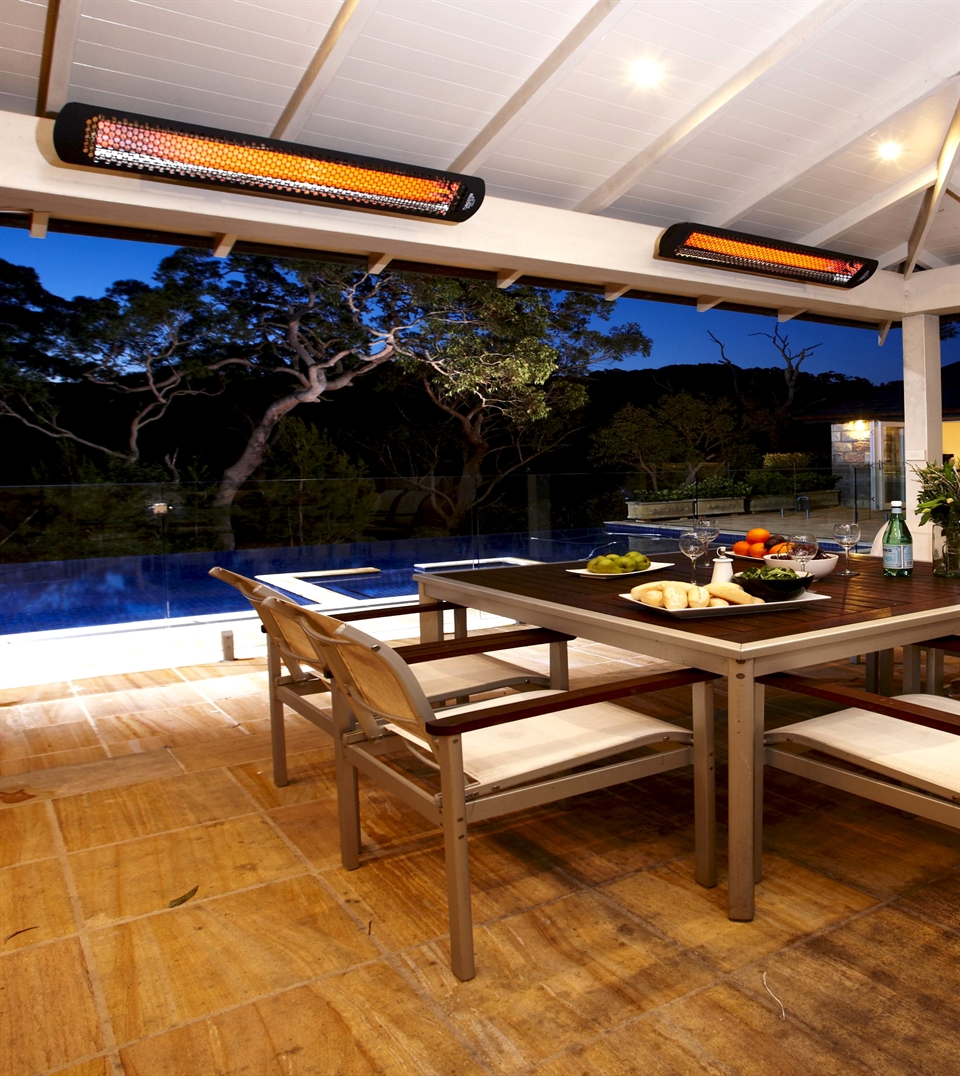 black style outdoor heaters attached to the underside of a patio ceiling of a residential area