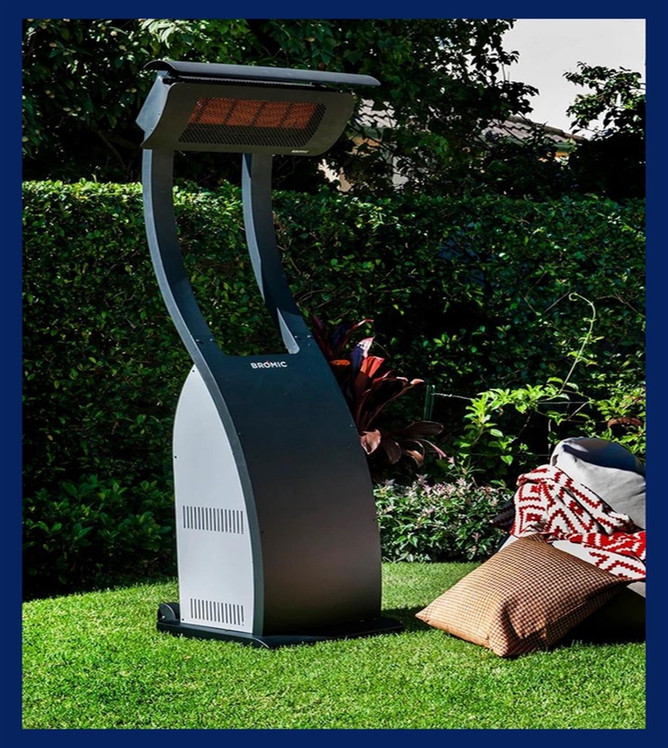 portable upright black heater in a garden in daytime overlooking patio furniture