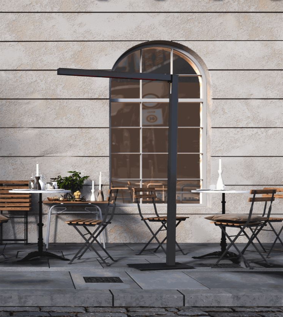 Heatsail TWIG floor lamp beside outdoor bistro tables against a stucco wall.