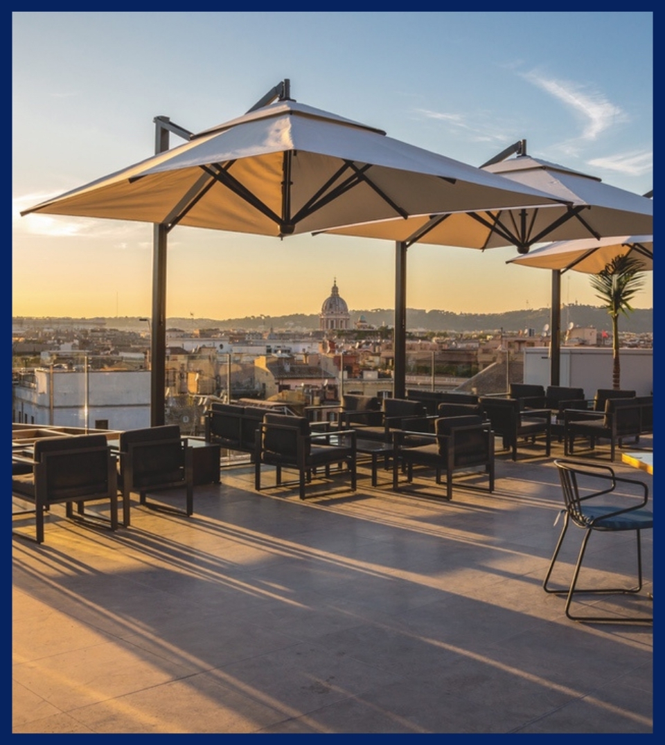 beige patio umbrella on an outdoor patio during sunset