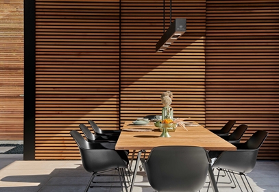 Heatsail BEEM light and heater above outdoor dining table.