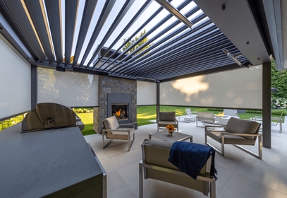 grey louvered retractable canopy in summer on porch with screens and heater