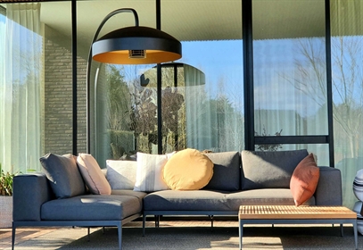 A single Disc adds comfort and warmth to this modern outdoor lounge.