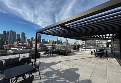 Cubrics High Rise fixed aluminum trellis on a rooftop commercial application