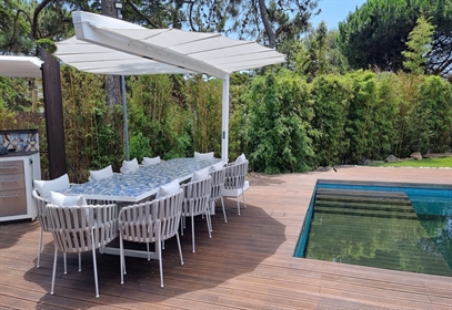 Heatsail Leaf canopy over poolside dining area with rope chairs