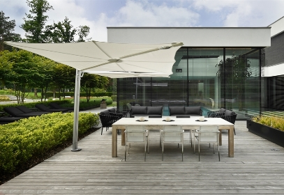White Spectra Duo umbrellas covering an outdoor patio space of a home