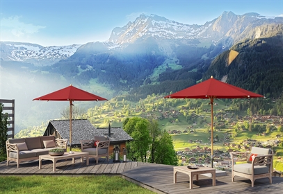 Red umbrellas used in a rural public establishment overlooking mountains