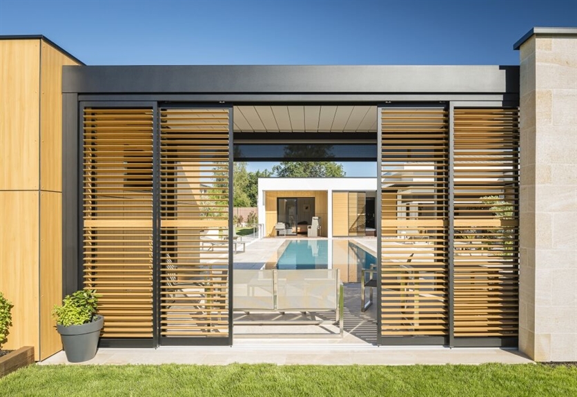 Wooden sliding screens create an enclosed space to shelter from the sun