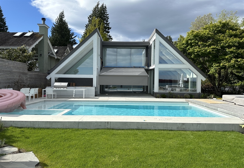 Awning shading a West Vancouver pool deck