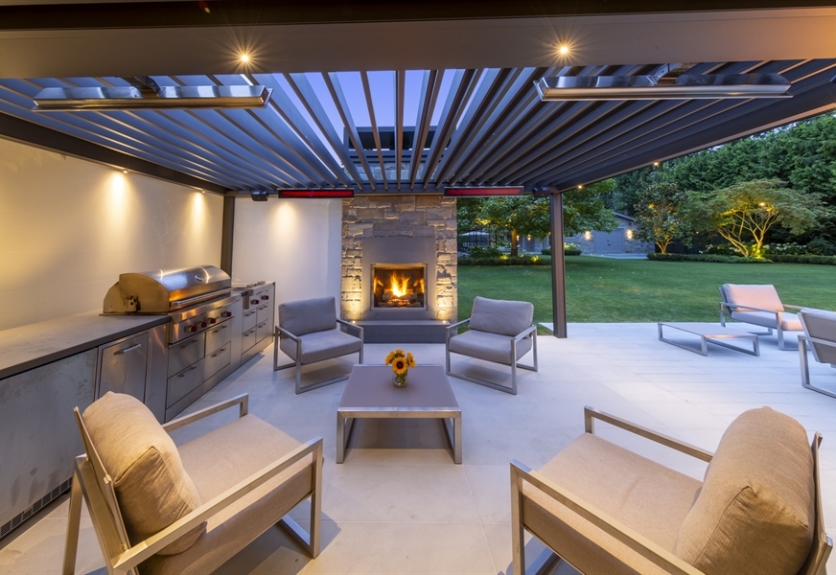 Skye pergola shelter an outdoor seating area with a fire 