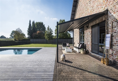 Retractable PVC Fabric pergola with Lighting attached to a home