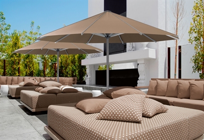 Outdoor Patio Umbrellas covering a residential patio overlooking the water