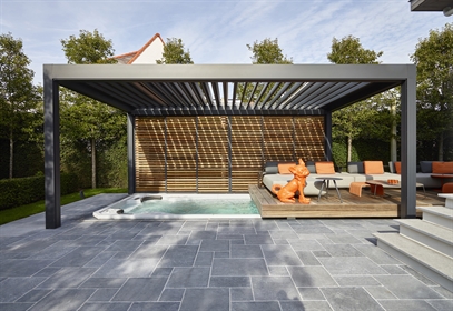 grey aluminum louvred roof with wooden side panels above a jacuzzi