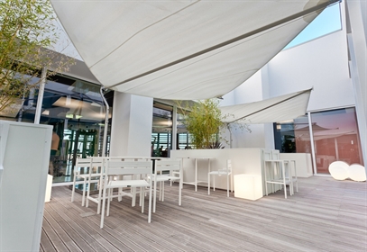 Corradi Defense shade sail with white Dacron sails rotated toward the sun