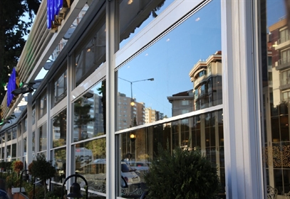 Miba High Low 2.0 motorized guillotine window system enclosing a patio.